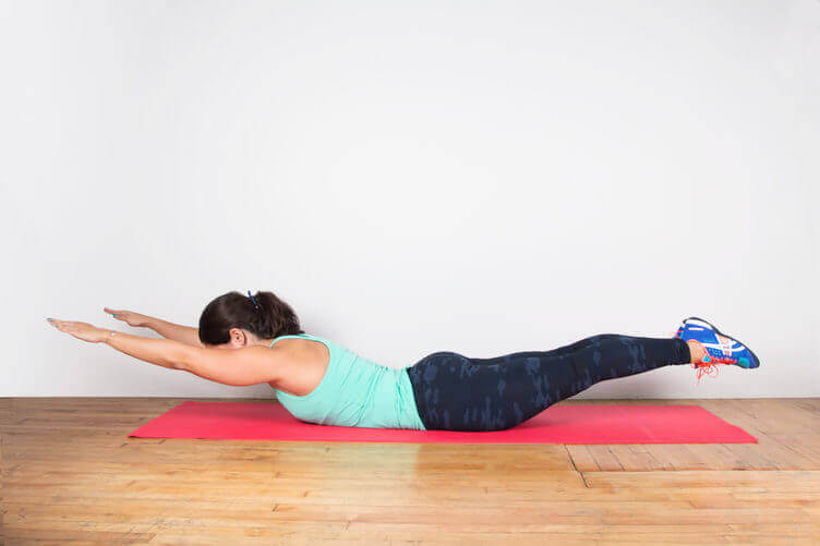 Stretching the lumbar spine on the floor back workouts